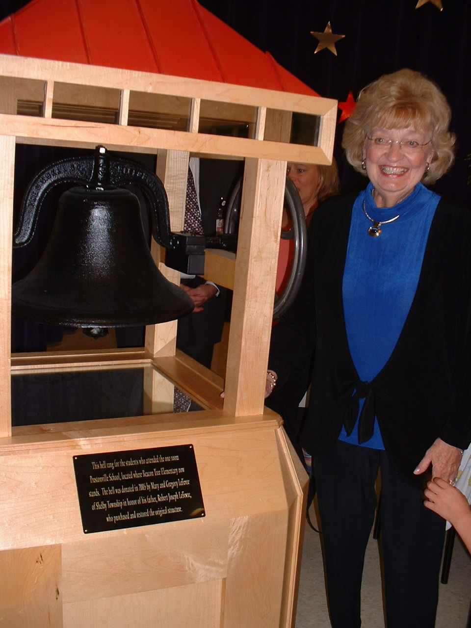 Prestonville Schoolhouse bell and donor Mary LeFevere.